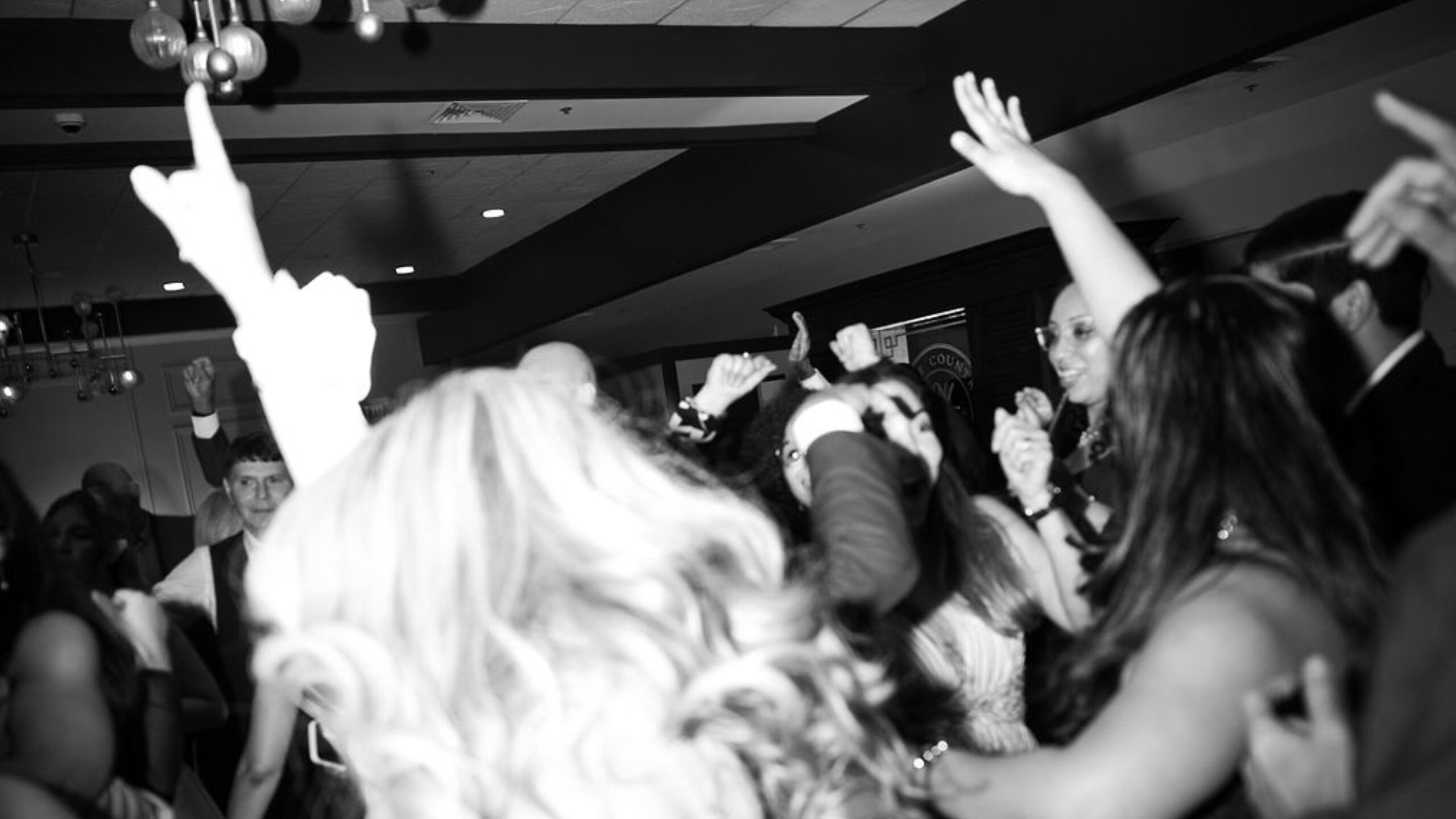 DJ Phil rocking a packed wedding dance floor in South Florida