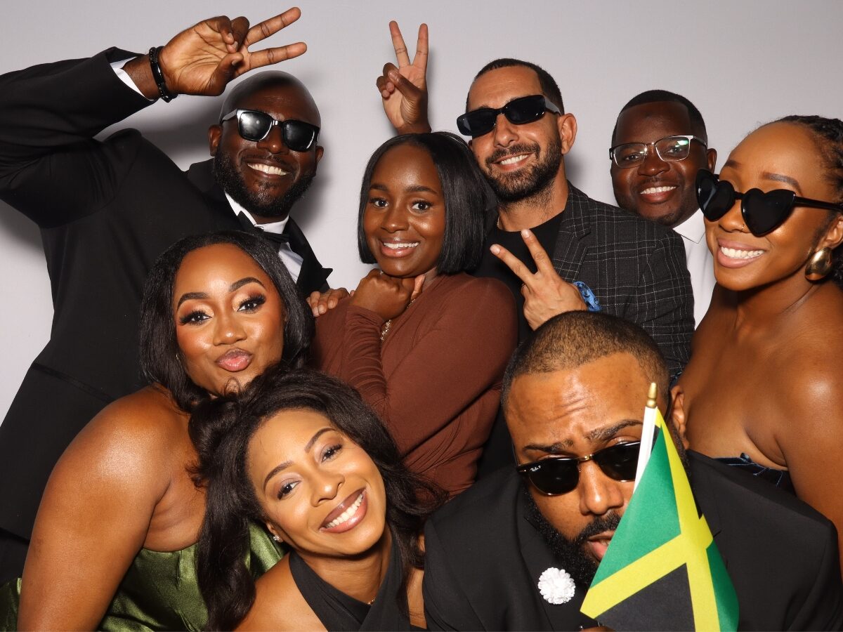 Newlyweds smiling in the Lux wedding photo booth in Miami