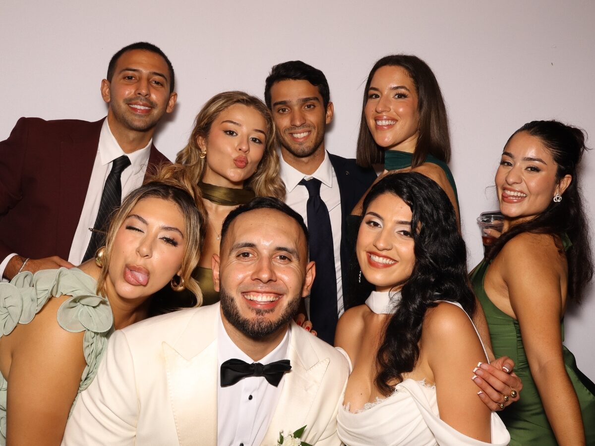 Groomsmen having fun in the wedding photo booth