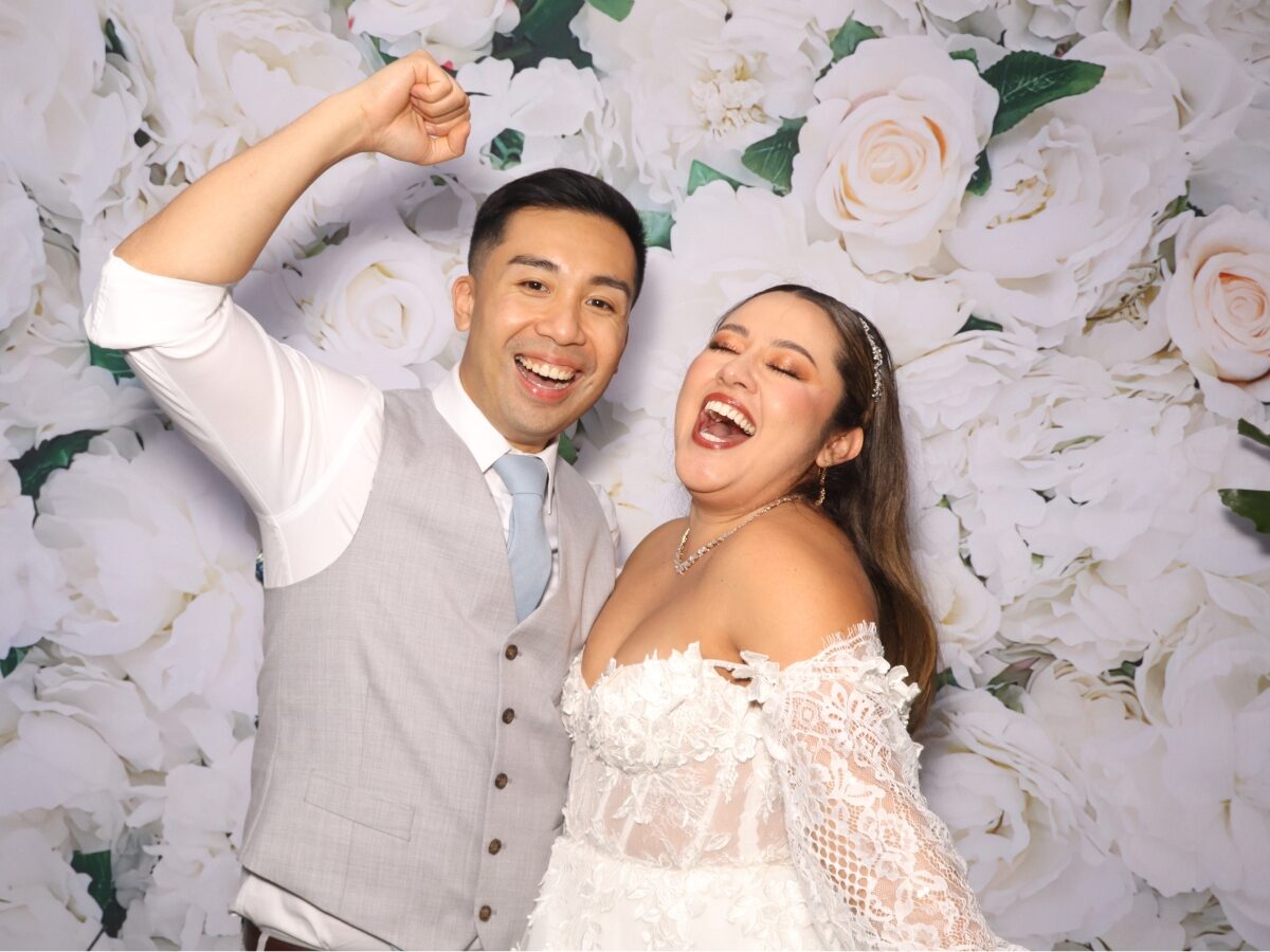 Guests with playful props in the Lux open-air photo booth