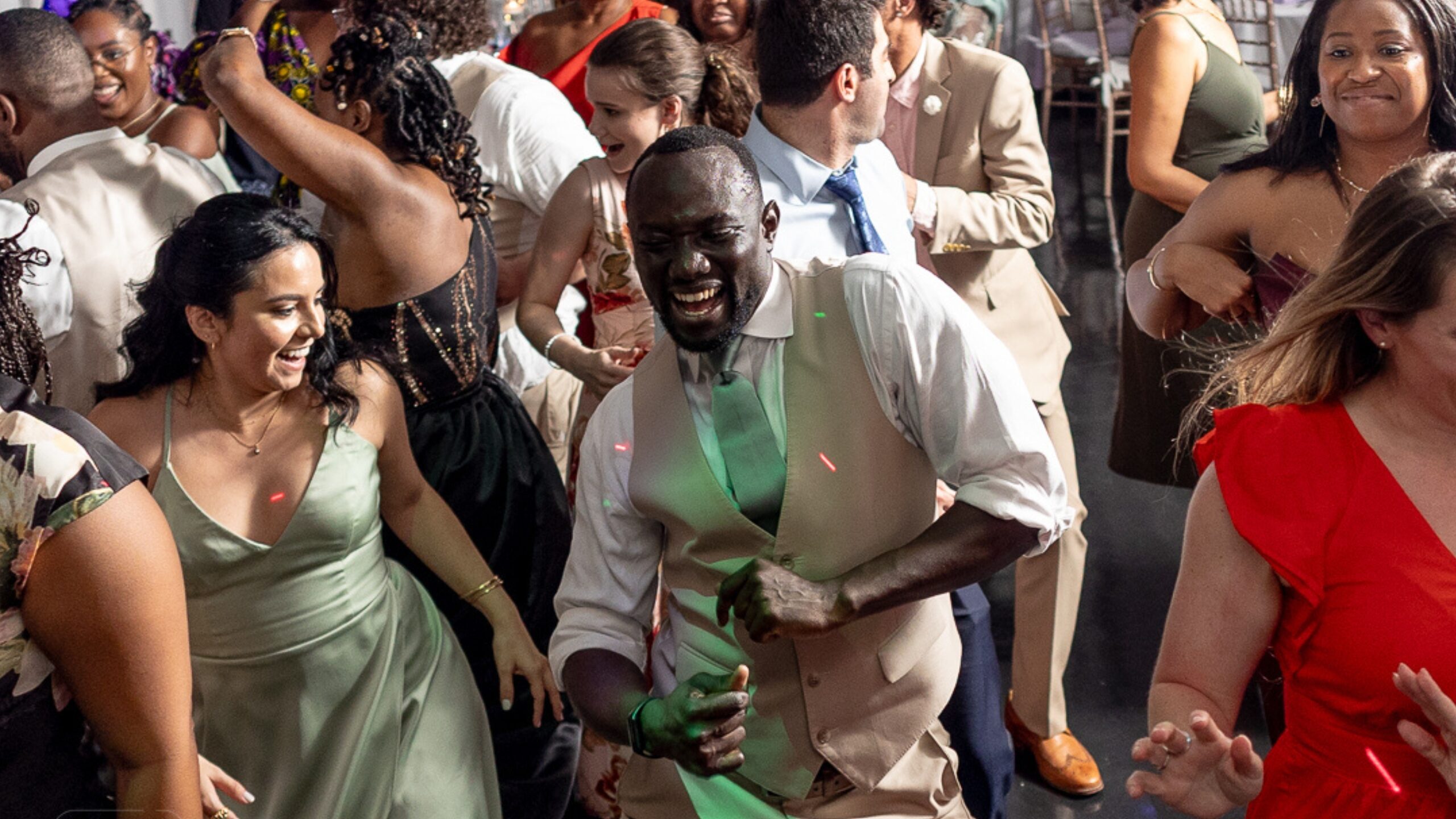 Wedding guests enjoying themselves on the dance floor