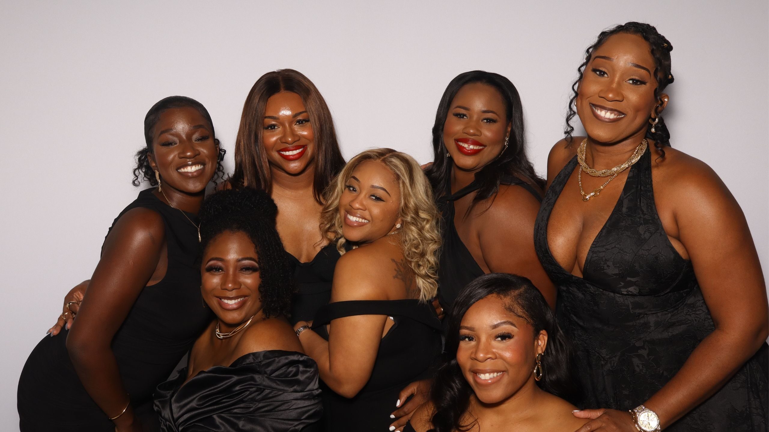 Group of guests posing in an Xpress Entertainment photo booth