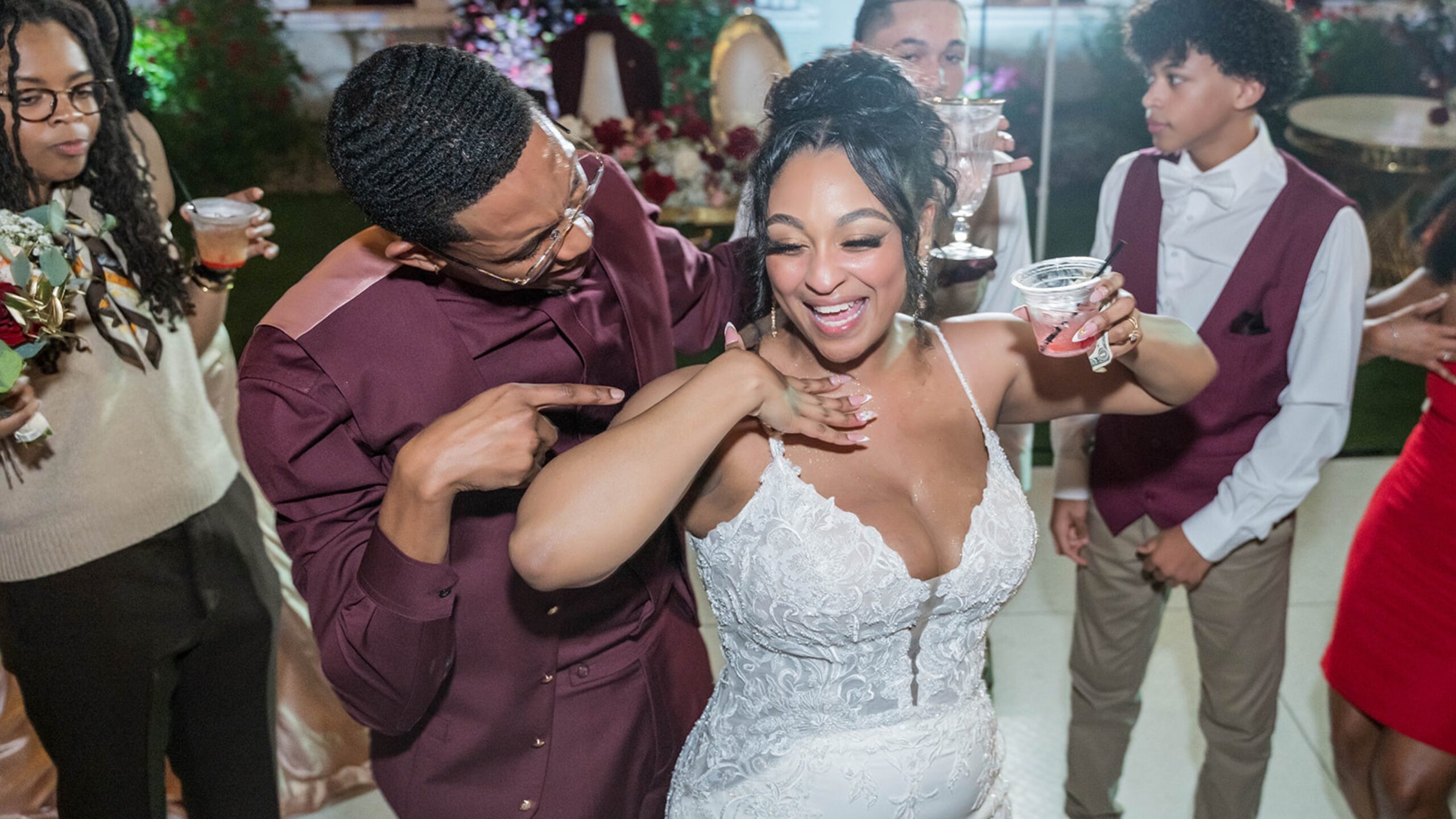 Newlyweds singing along to the music on the wedding dance floor