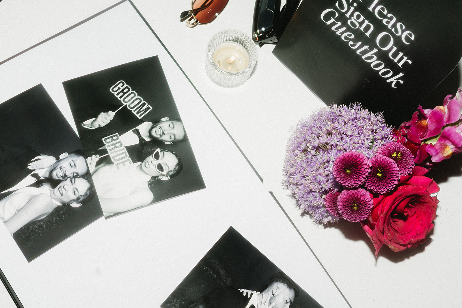 Signed photo booth guest book with photo strips and a heartfelt message