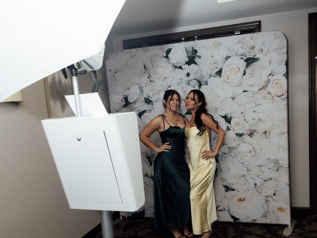 Wedding guests enjoying the Xpress Entertainment photo booth at a Miami reception