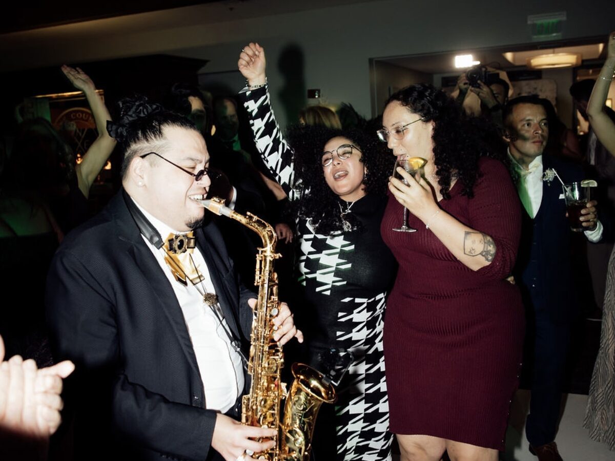 Live saxophone player performing with Xpress Entertainment on the wedding dance floor