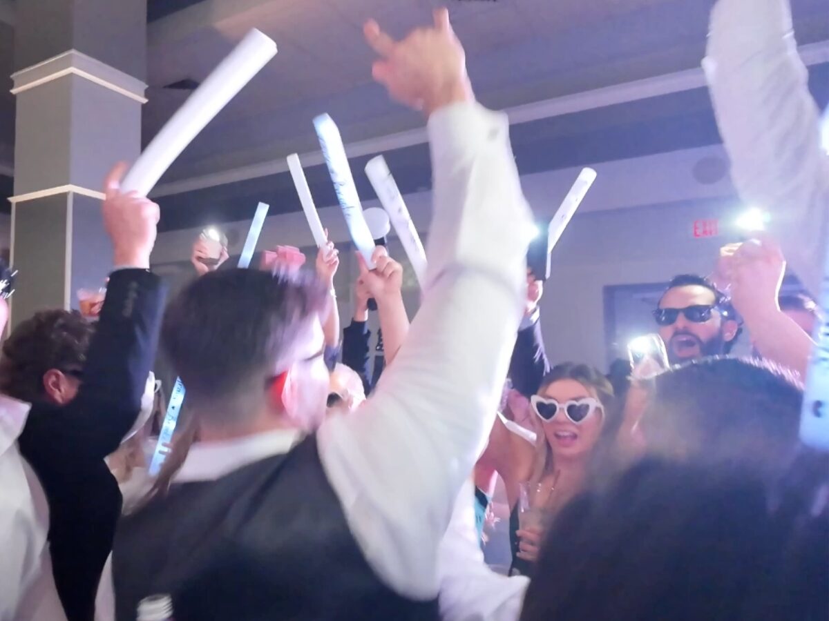 Wedding content creator capturing behind-the-scenes moments live at a reception
